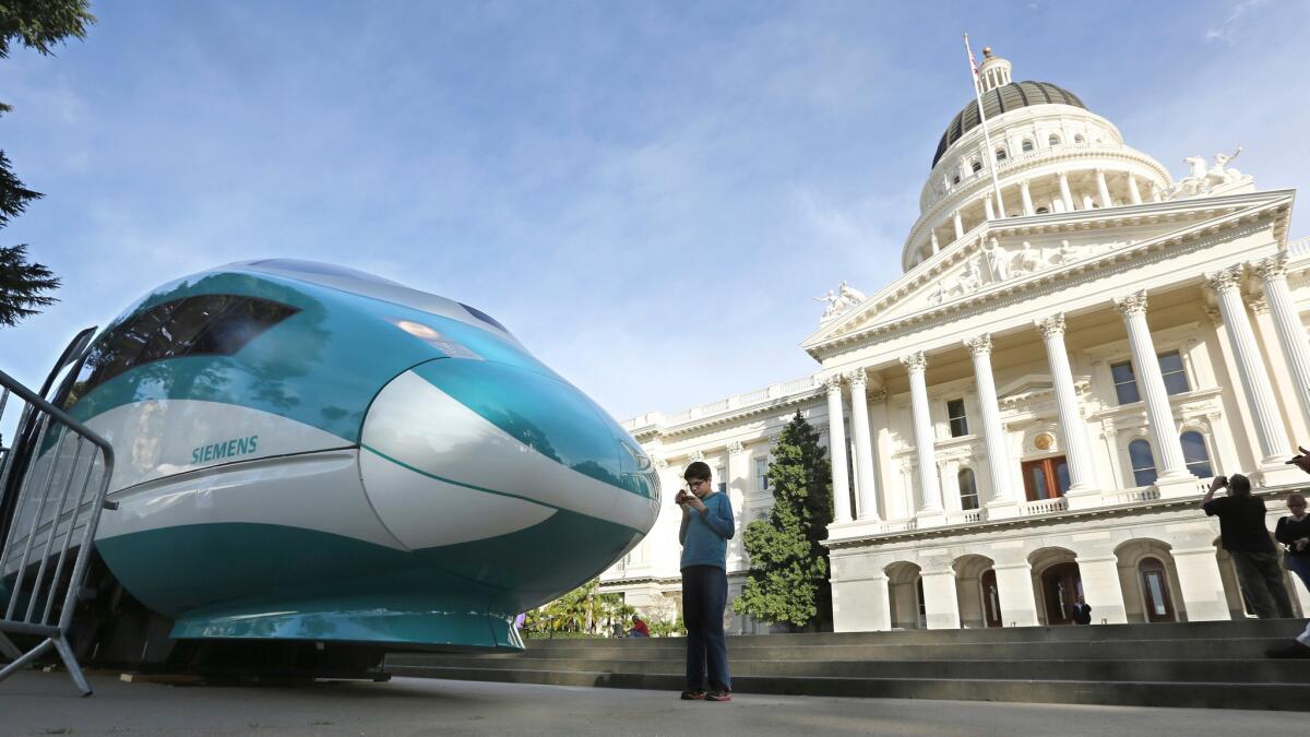 A mock-up of a high-speed train is displayed at the Capitol in Sacramento.