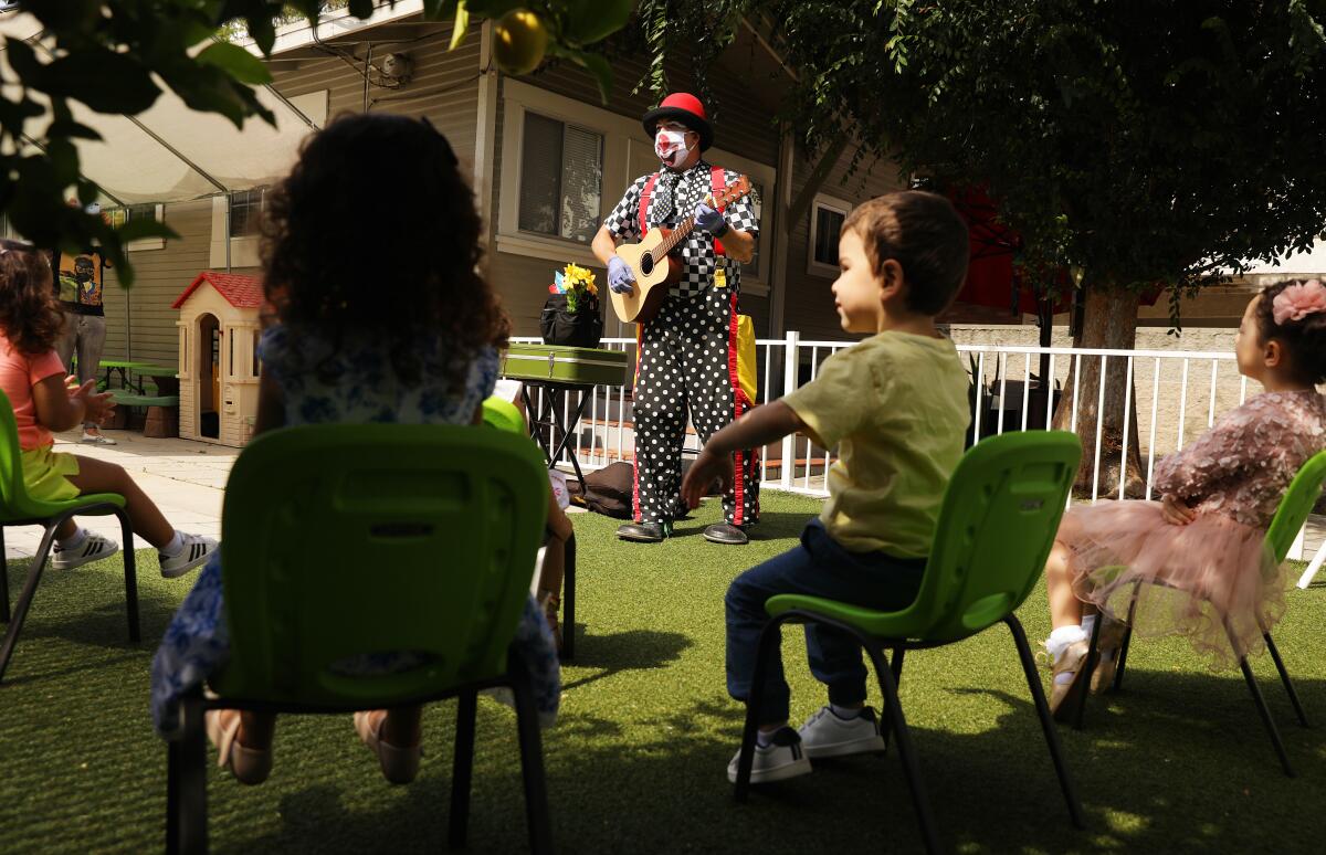 Guilford Adams performs a show for children at a preschool in Glendale on June 1.