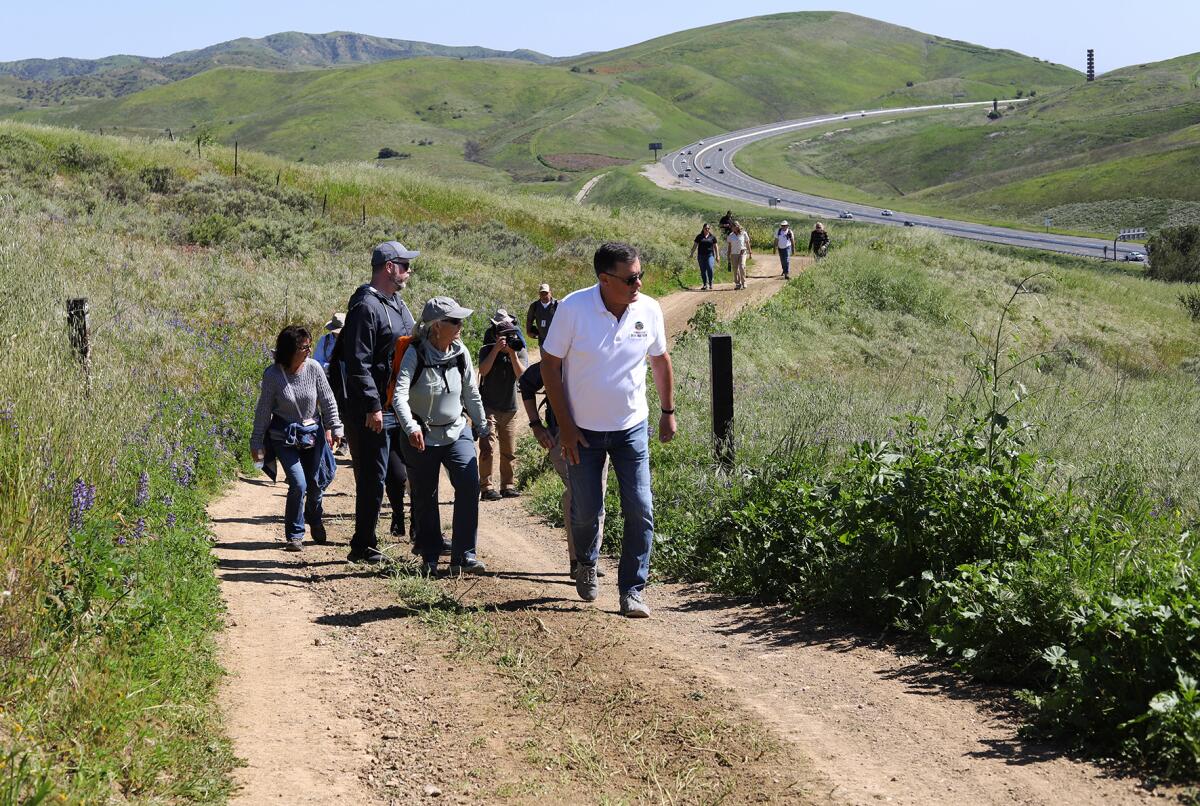 Orange County Supervisor Don Wagner leads a group of hikers on the new Saddleback Wilderness trail.