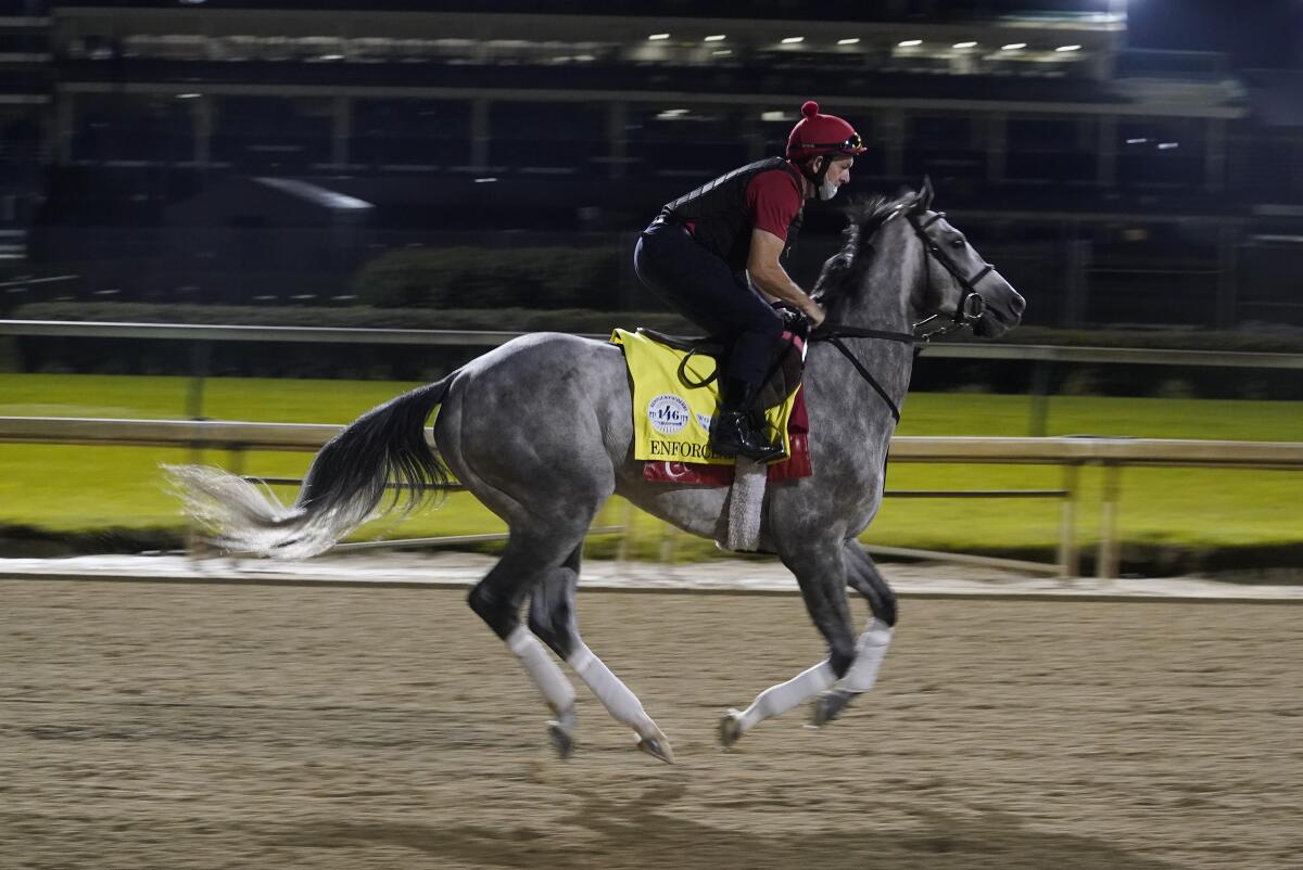 Enforceable takes part in a workout run at Churchill Downs on Friday.