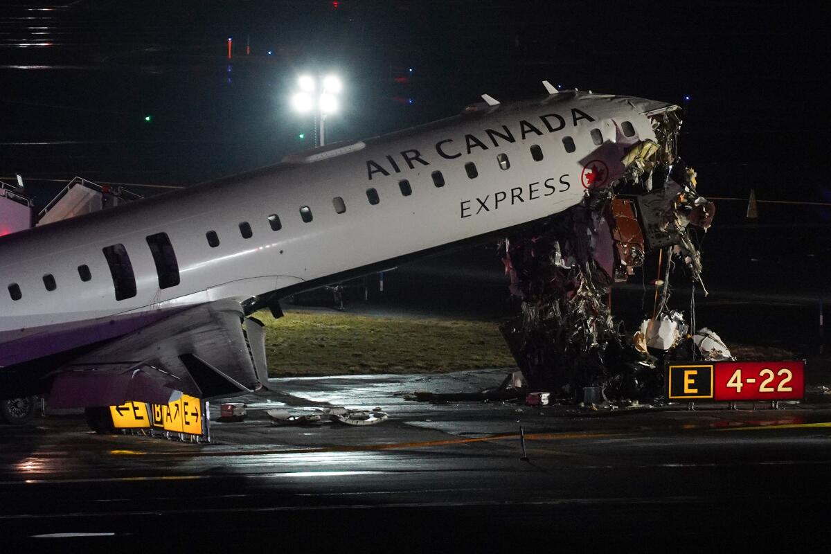 Jet collides with fire truck at New York's LaGuardia Airport. 2 pilots killed - Los Angeles Times