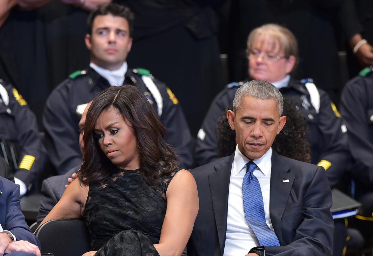 U.S. President Barack Obama and First Lady Michelle Obama attend an interfaith memorial service for the victims of the Dallas police shooting at the Morton H. Meyerson Symphony Center on July 12, 2016 in Dallas, Texas.