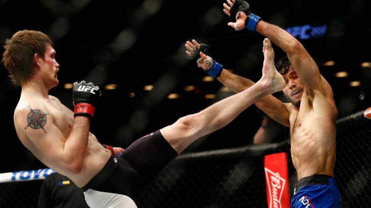 Rick Glenn throws a kick against Phillipe Nover during their featherweight fight at UFC 208. Glenn won the bout by split decision.