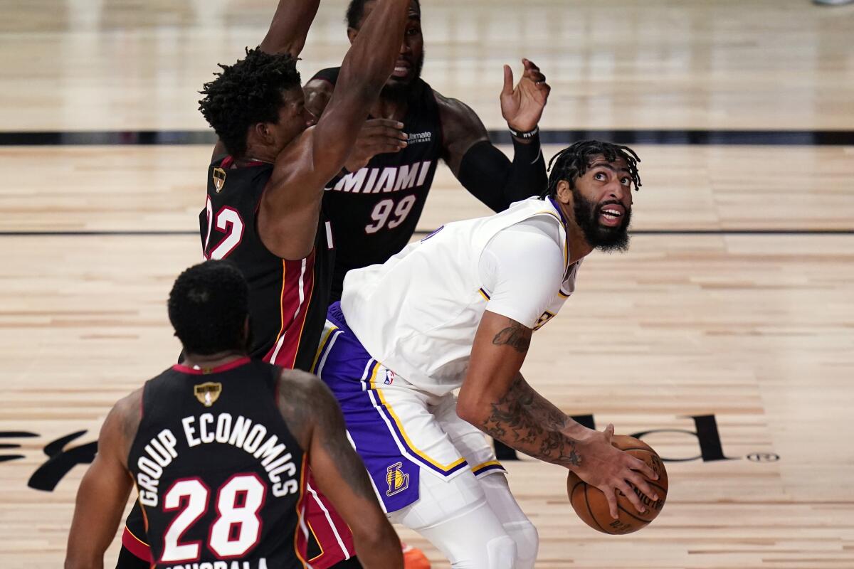 Lakers forward Anthony Davis powers his way to the basket against the Heat during Game 6.