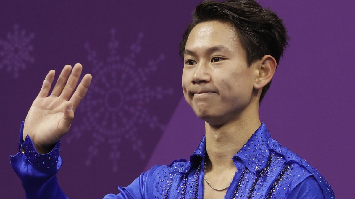Denis Ten reacts as his score is posted after his performance in the men's short program at the 2018 Winter Olympics in Gangneung, South Korea.