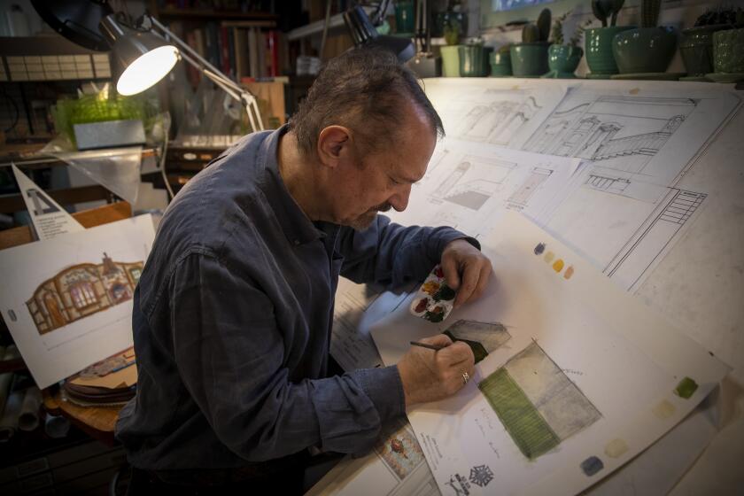 ATWATER VILLAGE, CALIF. -- FRIDAY, JANUARY 3, 2020: John Iacovelli, scenic designer, paints a portion of his set drawings for "Arsenic and Old Lace" at his home studio, which premiers at La Mirada at end of January. Photo taken at his home studio in Atwater Village, Calif., on Jan. 3, 2020. (Allen J. Schaben / Los Angeles Times)