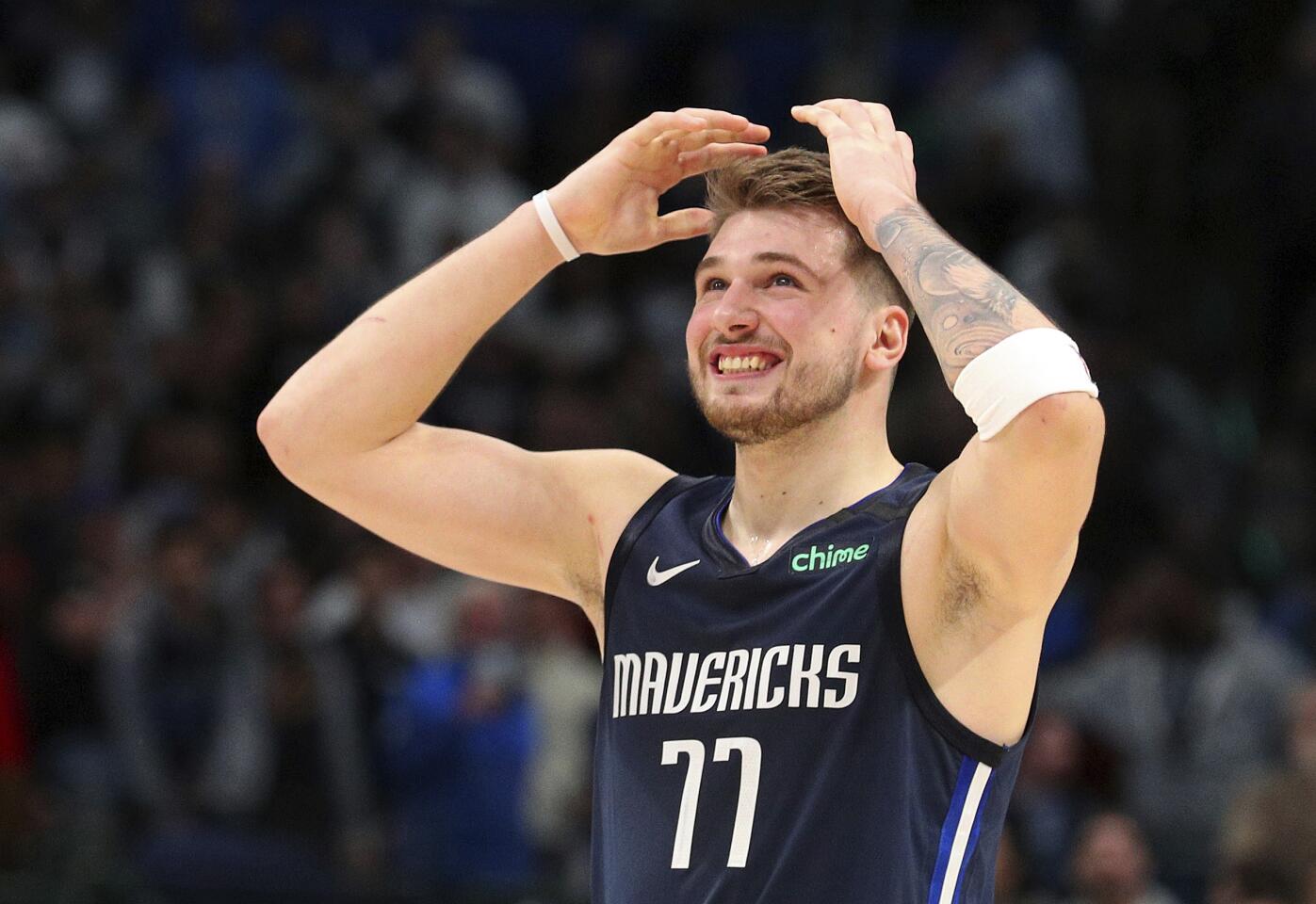 Mavericks forward Luka Doncic reacts after missing a three-pointer late in a game against the Clippers on Jan. 21.