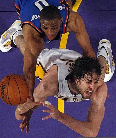 Lakers center Pau Gasol is fouled by Oklahoma City Thunder guard Russell Westbrook in the second half of Game 1 of the Western Conference playoffs at Staples Center.