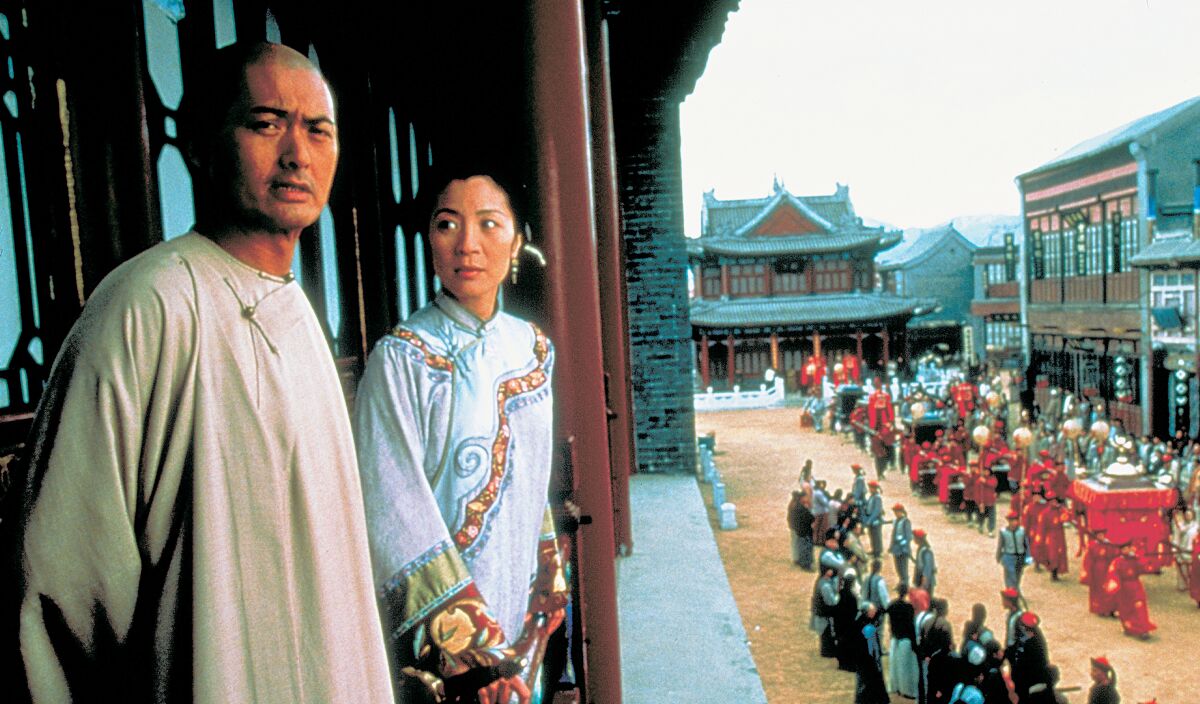 This photo released by Sony Pictures Classics shows Chow Yun Fat, left, and Michelle Yeoh in a scene from "Crouching Tiger, Hidden Dragon." Wednesday marks the 20th anniversary of the release of Ang Lee's movie, filmed in China and shot in Mandarin. The $17-million movie grossed $128.1 million in North America and was nominated for 10 Academy Awards, winning four. (Sony Pictures Classics via AP)