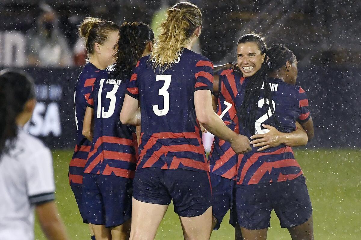 United States' Tobin Heath, second from right, celebrates with teammates after scoring 