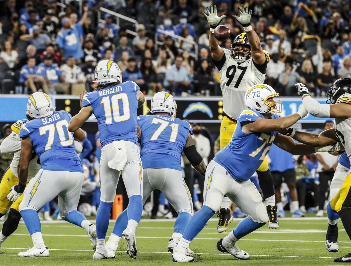 Steelers defensive end Cameron Heyward (97) blocks a pass thrown by Chargers quarterback Justin Herbert. 