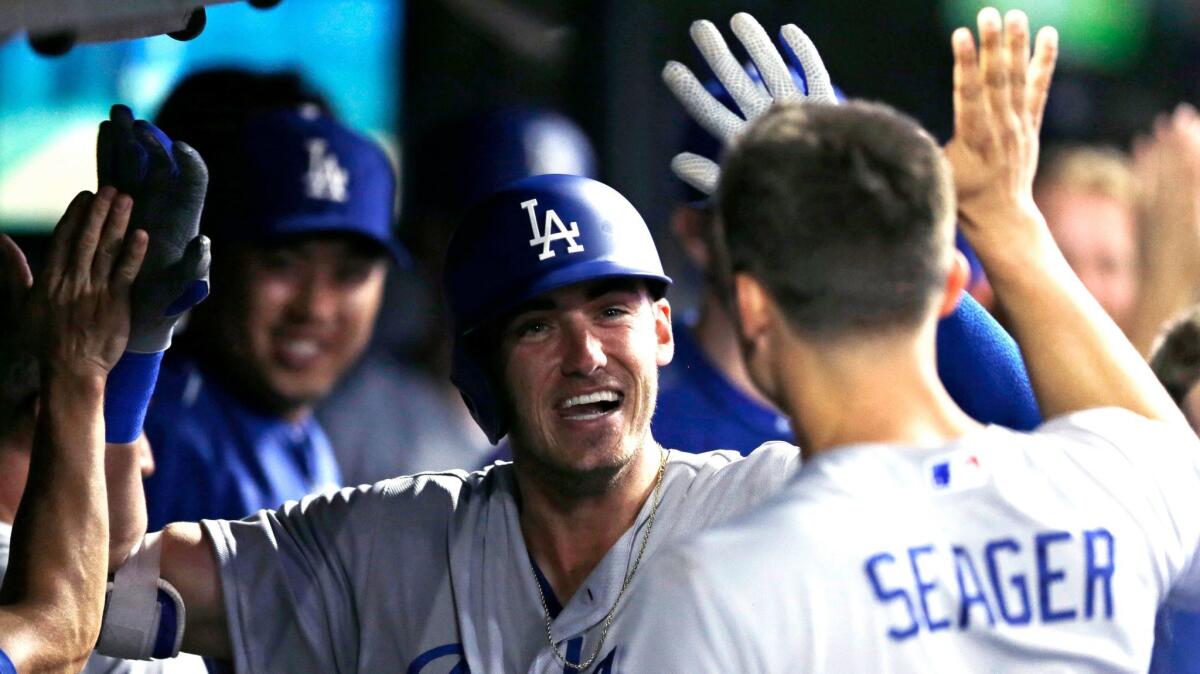 Dodgers' Cody Bellinger is congratulated by teammates after hitting a home run against Cleveland on June 13.