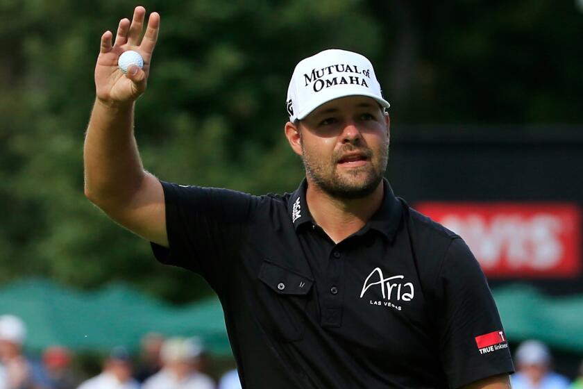 Ryan Moore acknowledges the crowd at No. 18 on Sunday after winning the John Deere Classic.