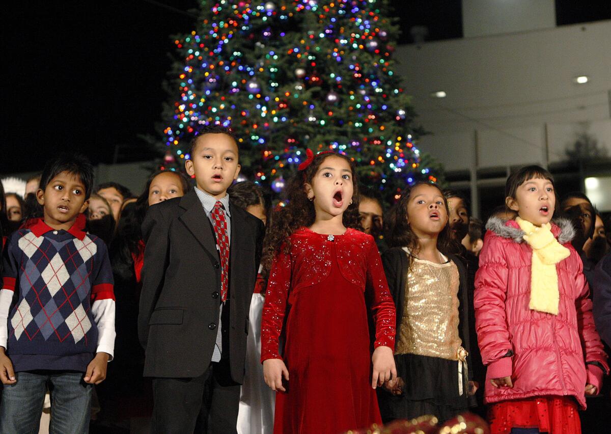 Students from Cerritos Elementary School sing Christmas songs at the lighting of the Christmas tree at Parcher Plaza at Glendale City Hall on Wednesday, December 4, 2013. (Tim Berger/Staff Photographer)