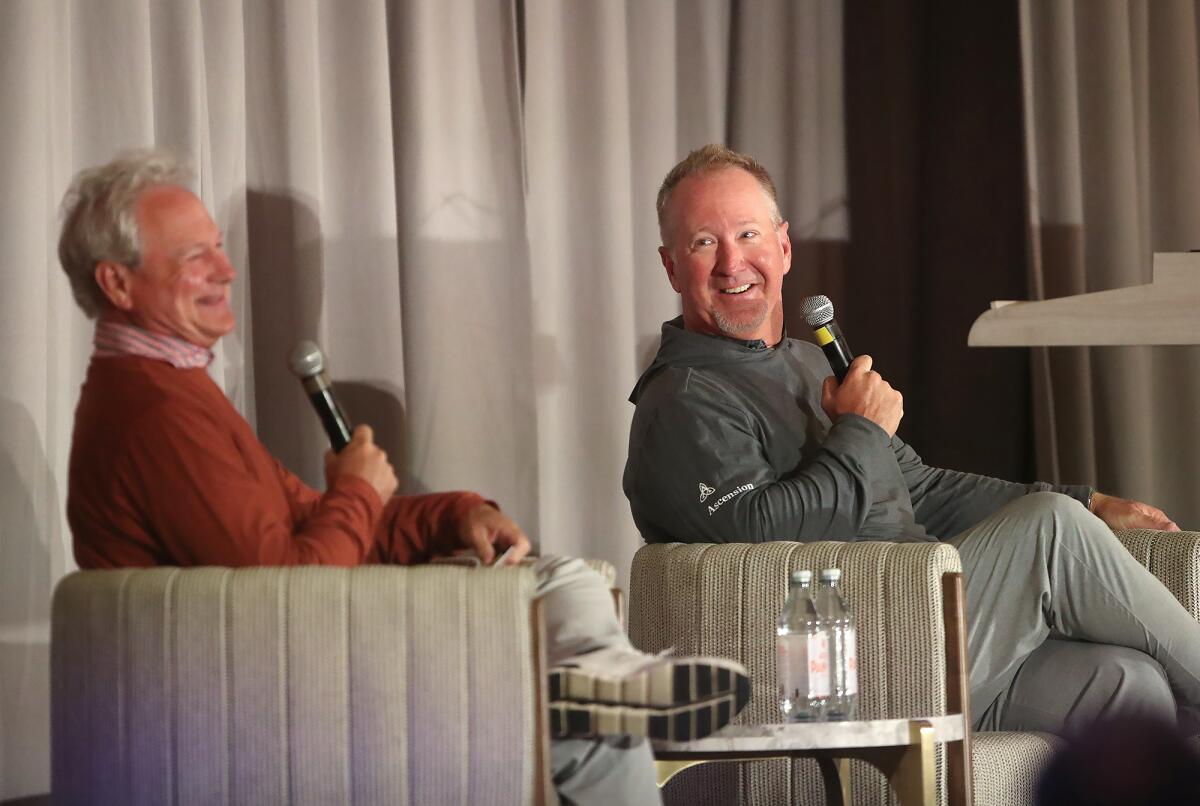Moderator John Cook, a former PGA Tour golfer himself, and David Duval, from left, share stories and laughs on Tuesday.