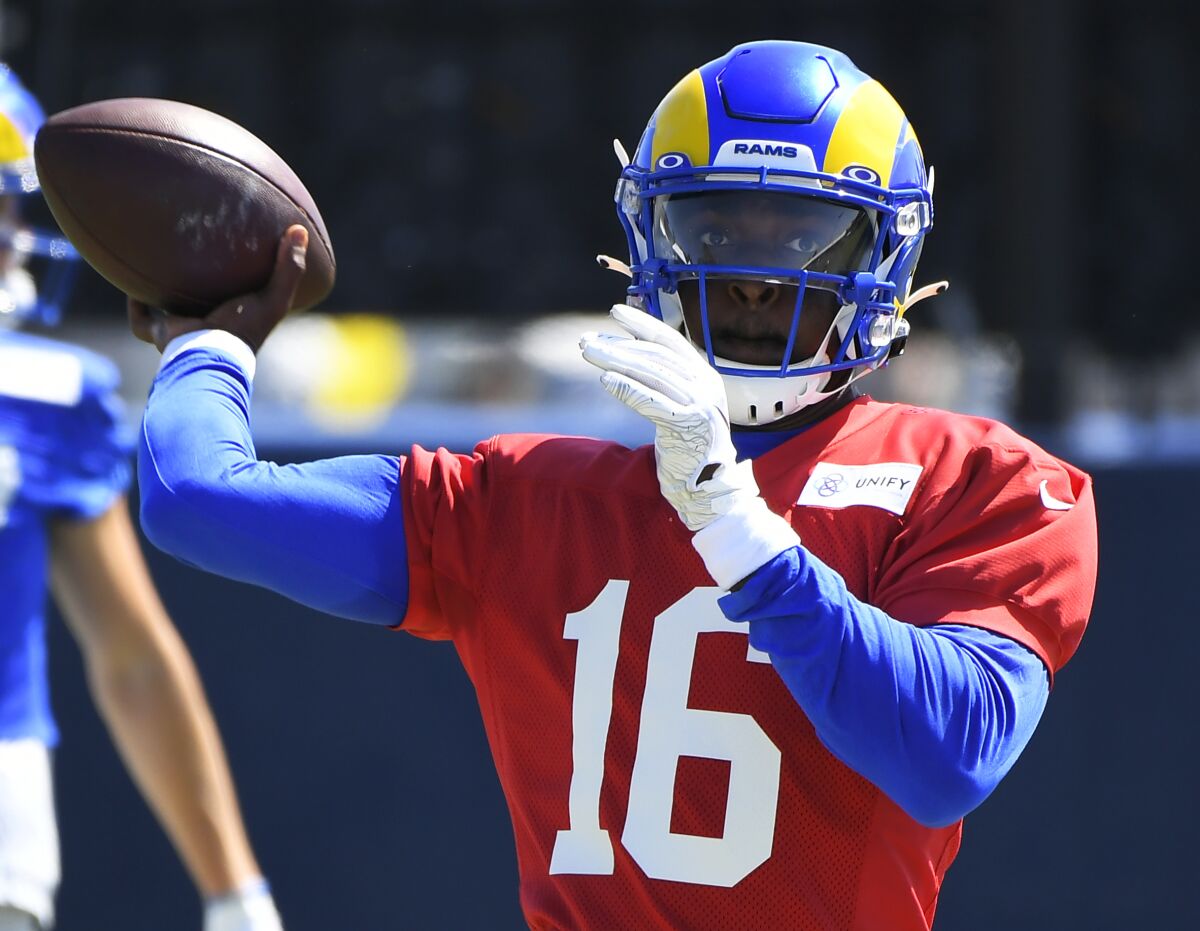 Rams quarterback Bryce Perkins throws a pass in training camp last year.
