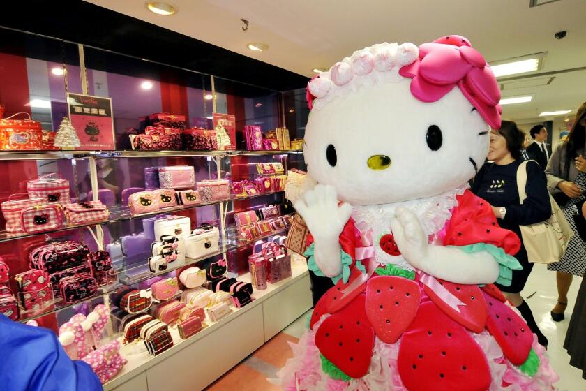 Hello Kitty pays a visit to the world's largest Sanrio character goods shop upon its opening in Tokyo in 2009.