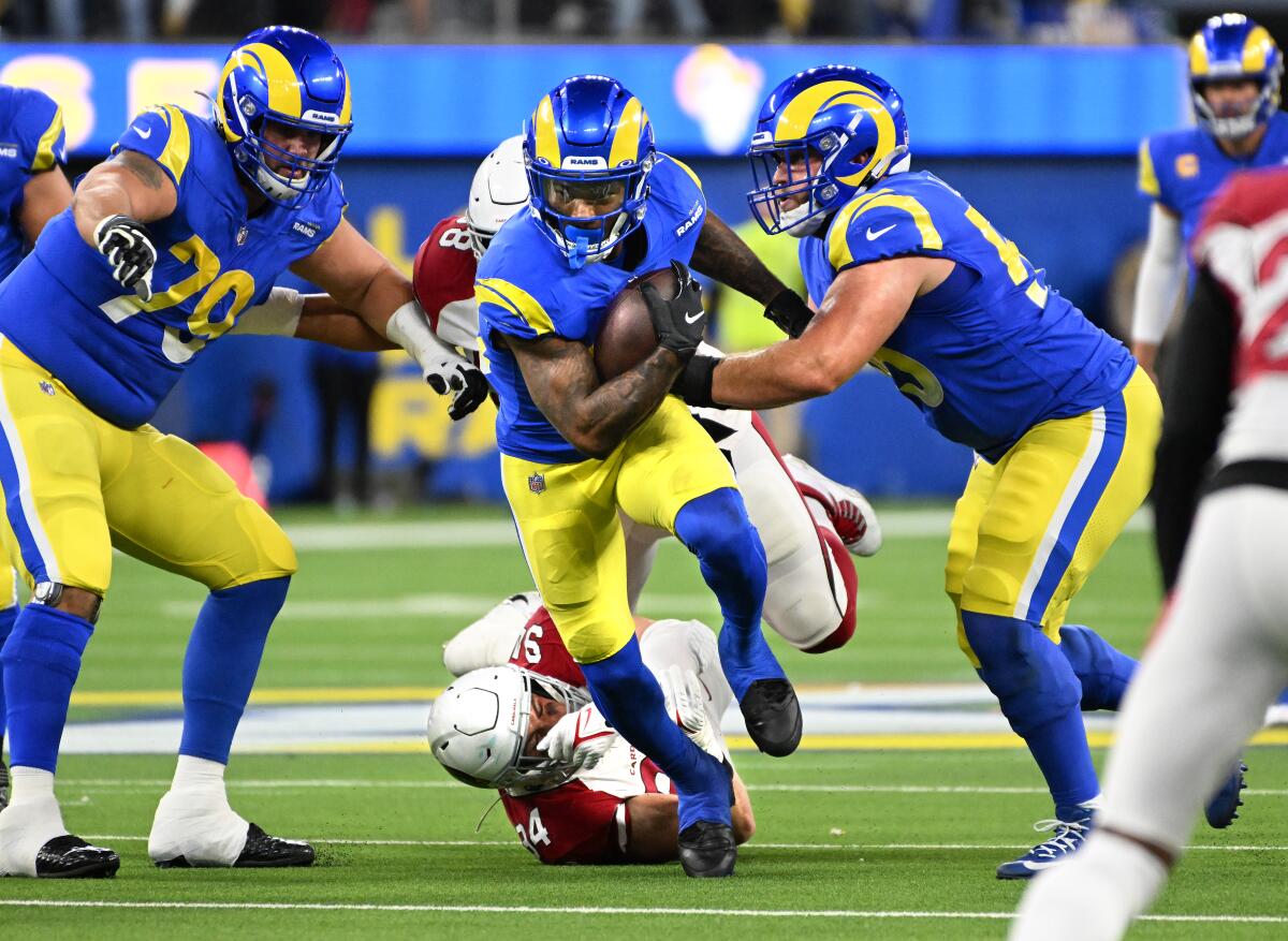 Rams running back Cam Akers breaks a tackle against the Arizona Cardinals.