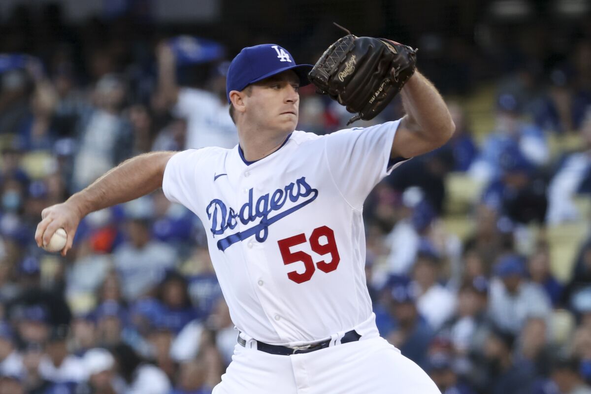 Dodgers pitcher Evan Phillips delivers a pitch during the first inning in Game 5 of the NLCS.