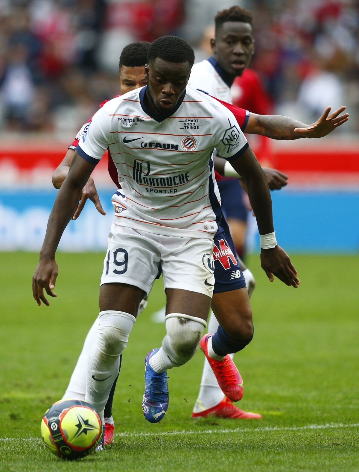 FILE - Montpellier's Stephy Mavididi controls the ball during the French League One soccer match between Lille and Montpellier at the Stade Pierre Mauroy stadium in Villeneuve-d'Ascq, France, on Aug. 29, 2021. It has been a long wait for Stephy Mavidi and Montpellier. But after more than a year without finding the net, the English striker scored a double over the weekend, hitting form again at the right time just before leader PSG's visit midweek. (AP Photo/Michel Spingler, File)