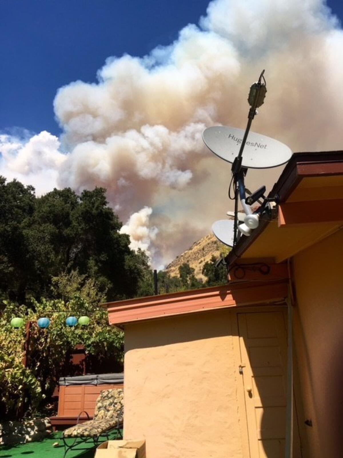 Smoke billows over the Arroyo Seco home of Vanessa and Kit Radley, who live in a valley that was once in the path of the long-burning Soberanes fire in Monterey County. (Vanessa and Kit Radley)