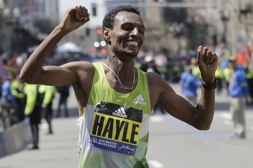 Ethiopia's Lemi Berhanu Hayle celebrates after winning the 120th Boston Marathon on Monday.