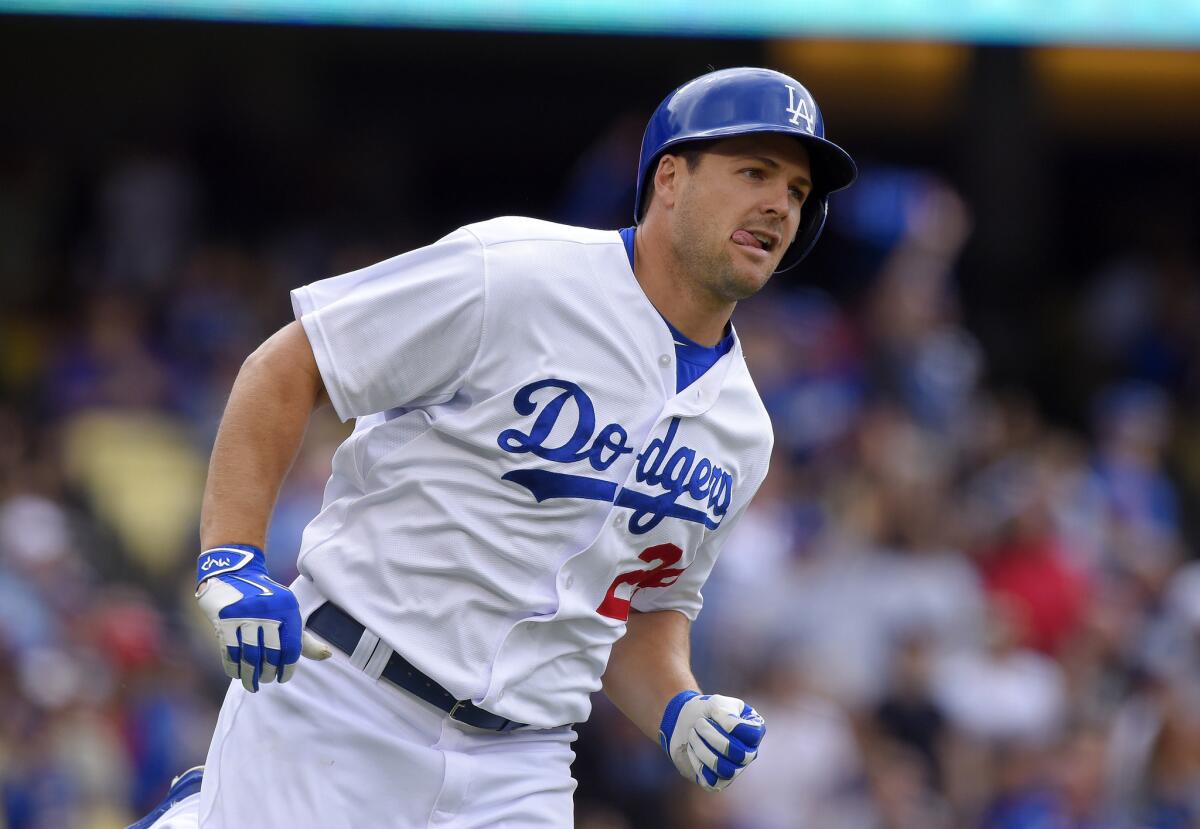 Chris Heisey runs after hitting a home run during against San Diego on Oct. 4.