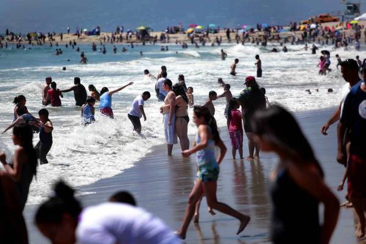 One summertime ritual in L.A. is flocking to the seashore, at such spots as this packed Venice Beach.