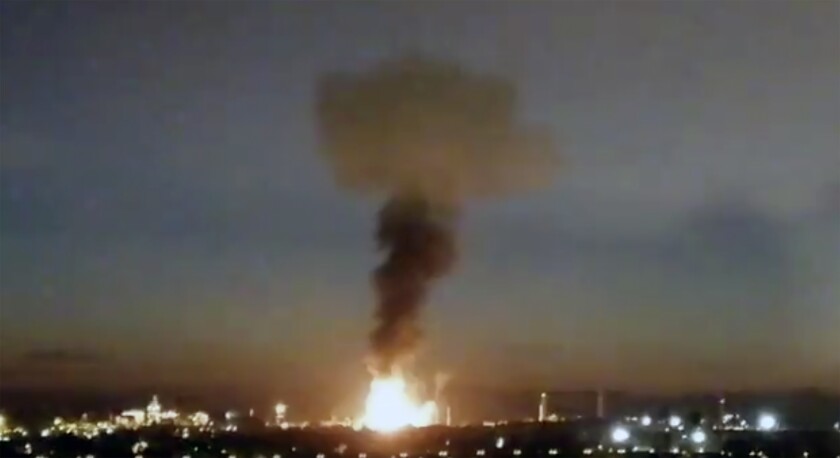 In this image made from video provided by Laura_presicce, a fire is seen in Tarragona, Spain, Tuesday, Jan. 14, 2020. A massive explosion took place at an industrial zone for chemicals in northeastern Spain on Tuesday, and the regional emergency services agency warned people nearby not to go outside. A tweet by emergency services for the Catalonia region called the blast in the port city of Tarragona a “chemical accident” and said no information on possible deaths or injuries was available. (Laura_presicce via AP)