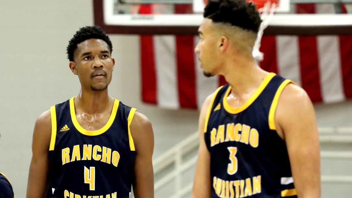Rancho Christian's Evan Mobley (4) and his brother Isaiah (3) during a game against Powder Springs (Ga.) McEachern at the Hoophall Classic in Springfield, Mass., on Jan. 21.