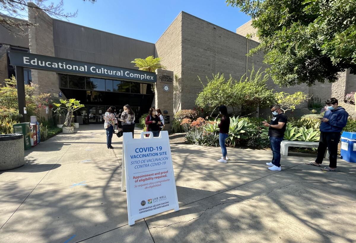 People line up outside the vaccination center at the Educational Cultural Complex in Mountain View.