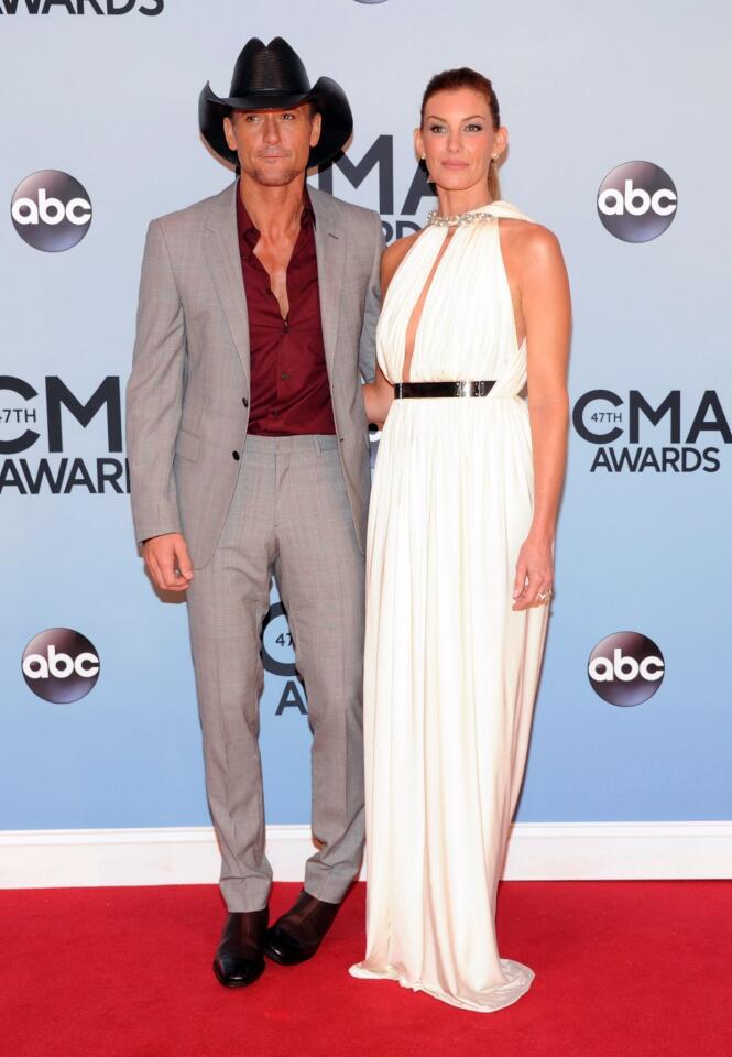 Tim McGraw, left, and Faith Hill arrive at the 47th annual CMA Awards at Bridgestone Arena in Nashville.
