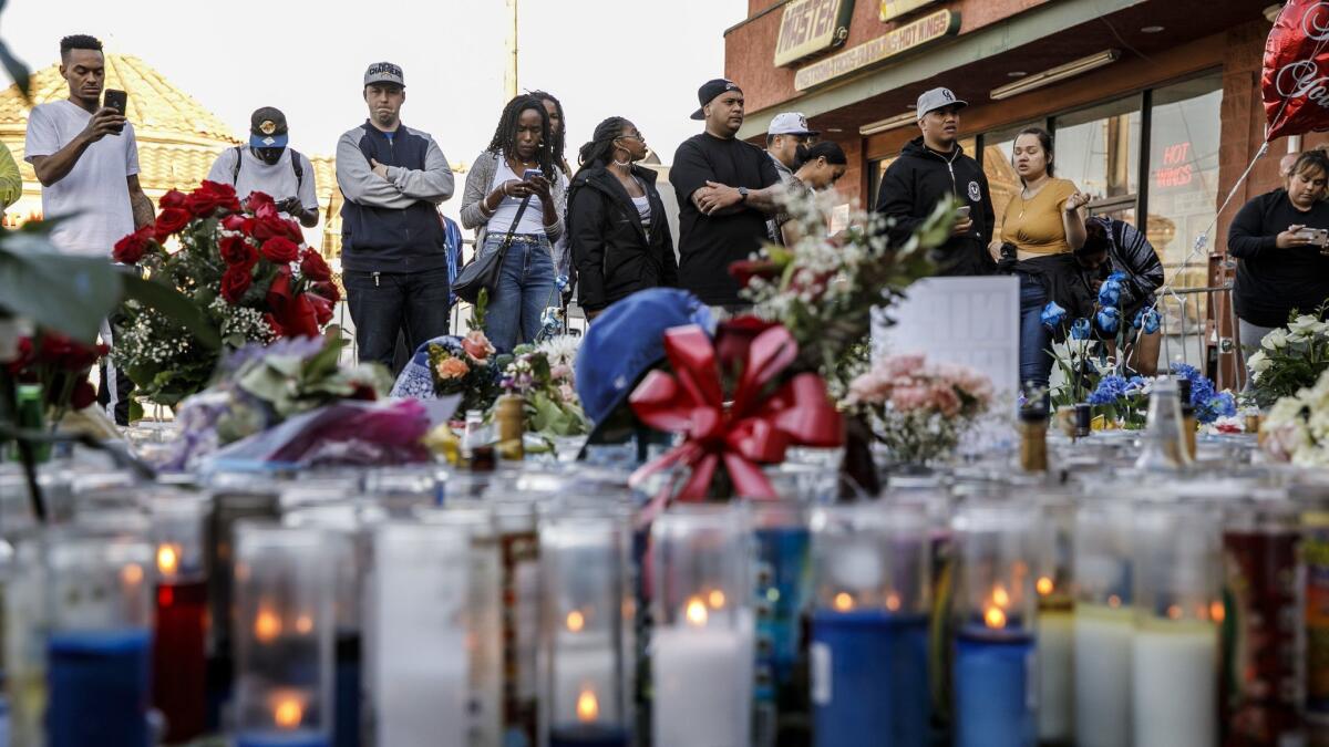Mourning fans continue to gravitate to the parking lot where Nipsey Hussle was shot.