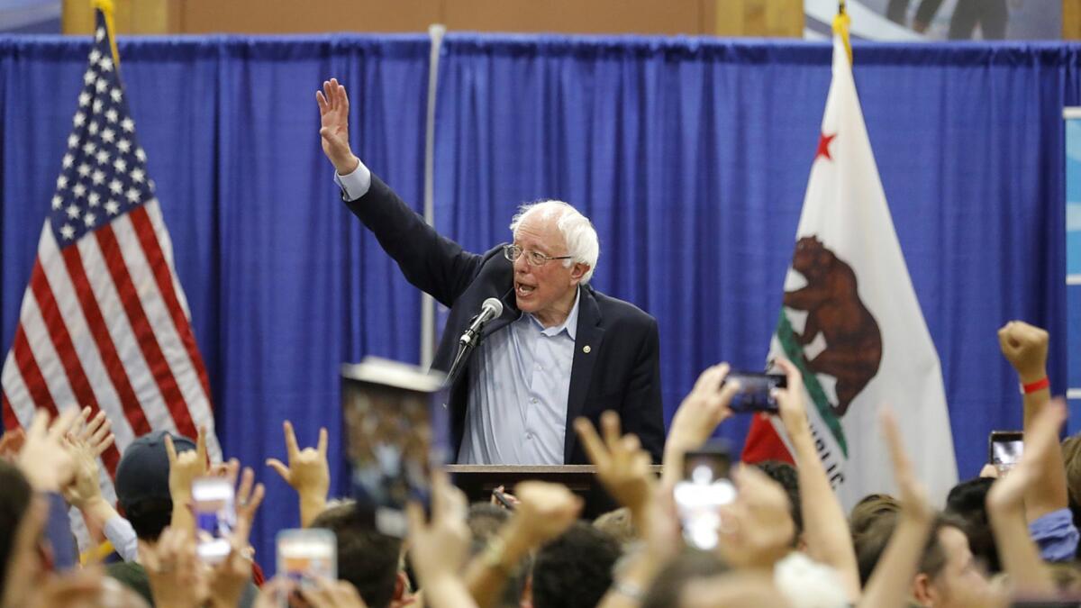 Sen. Bernie Sanders speaks to a crowd at MiraCosta College in Oceanside on Friday night as he stumps for Democratic candidates running for seats in the midterm election.