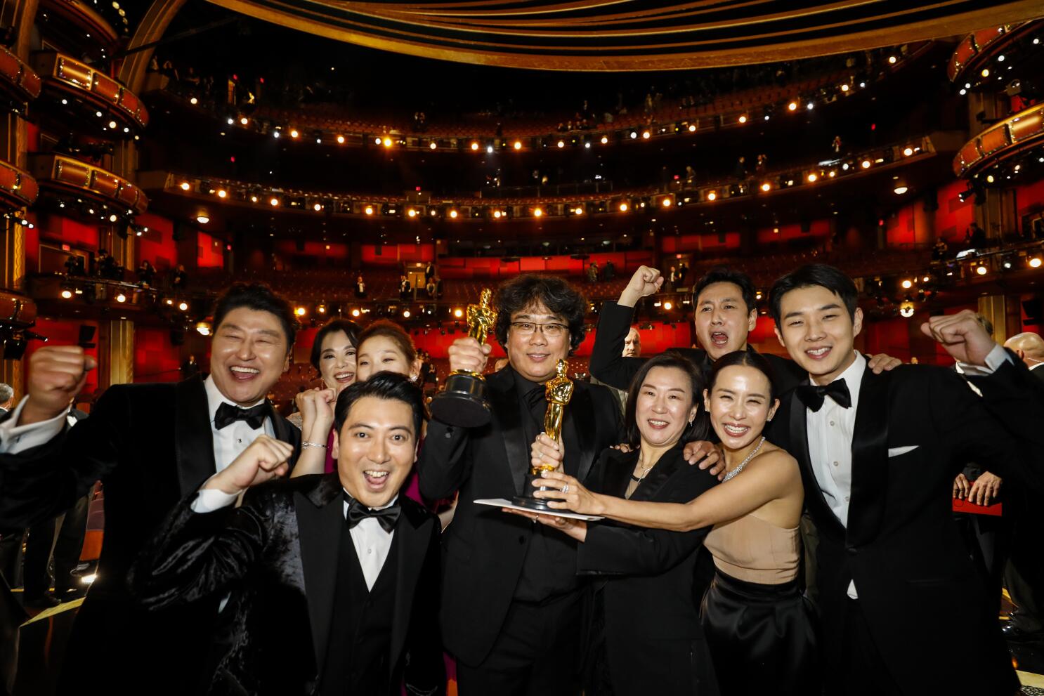 Parasite director Bong Joon Ho and cast members walking on the red carpet  at the 92nd Annual Academy Awards held at the Dolby Theatre in Hollywood,  California on Feb. 9, 2020. (Photo