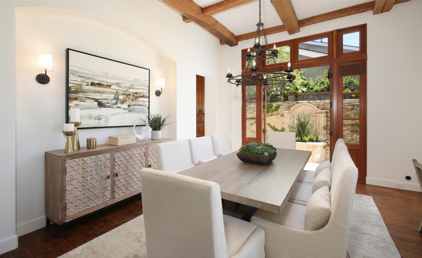 French doors connect the dining room to the backyard.