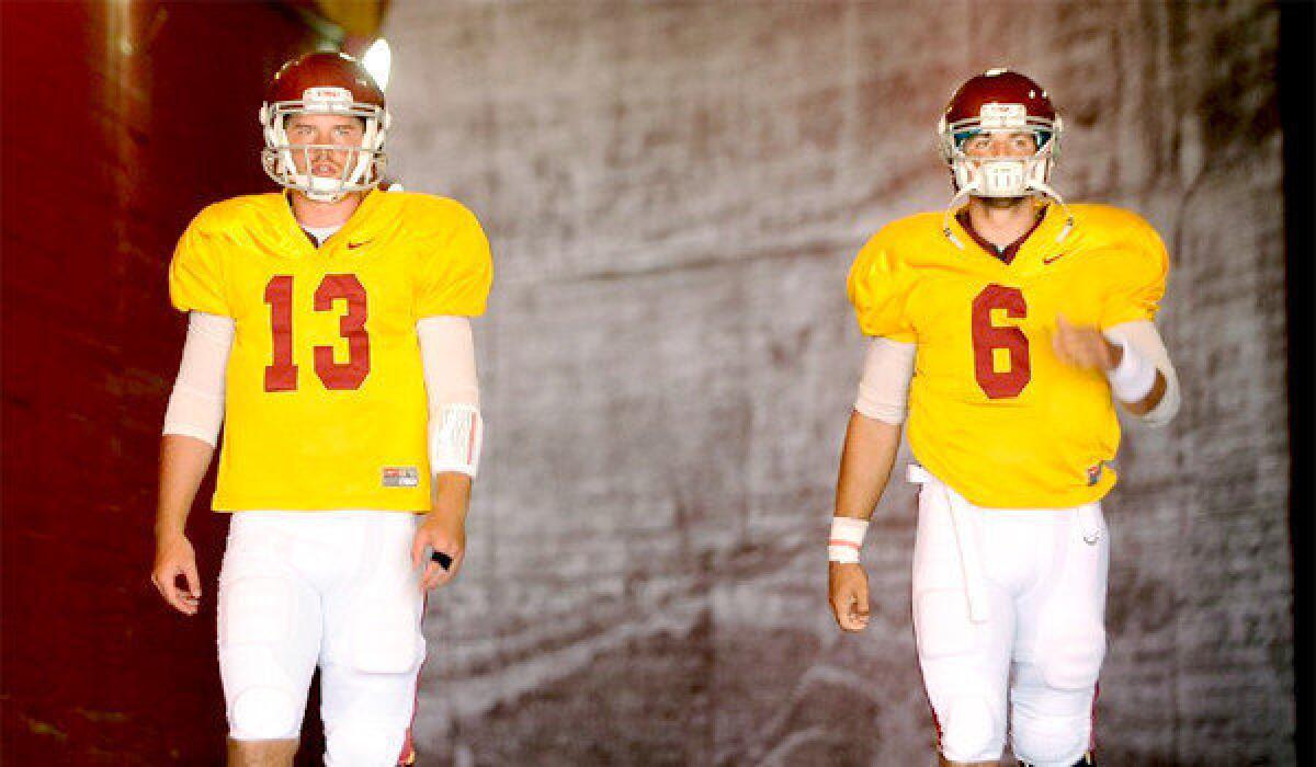 USC Coach Lane Kiffin says both Max Wittek, left, and Cody Kessler, right, will play quarterback for the Trojans during their season-opener at Hawaii on Thursday.