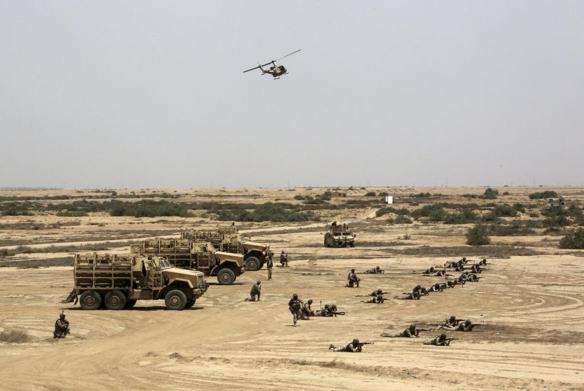 Iraqi, U.S. and Spanish soldiers participate in a training mission outside Baghdad on May 27.