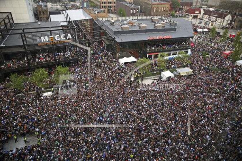 Fans gather in the Deer District for Game 6 of the NBA Finals between the Milwaukee Bucks and the Phoenix Suns at Fiserv Forum on Tuesday, July 20, 2021, in Milwaukee. (Angela Peterson/Milwaukee Journal-Sentinel via AP)