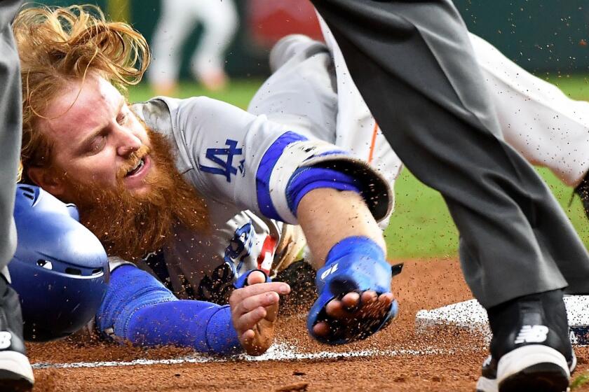 HOUSTON, TEXAS OCTOBER 29, 2017-Dodgers Justin Turner is tagged out at 3rd base on a failed sacrafice bunt form Kiki Hernandez in the 7th inning in Game 5 of the World Series at Minute Maid Park in Houston Sunday. (Wally Skalij/Los Angeles Times)