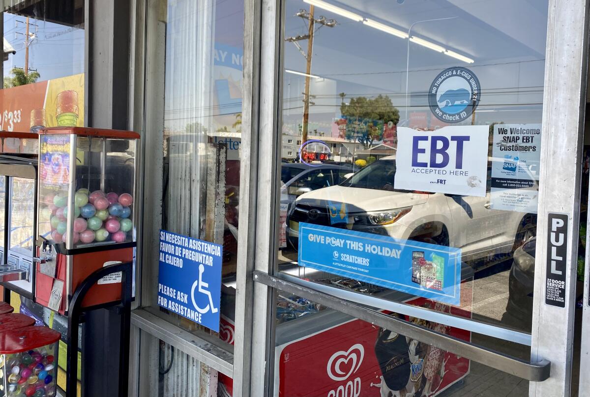 A local store displays a sticker stating it accepts Electronic Benefit Transfer or EBT cards.