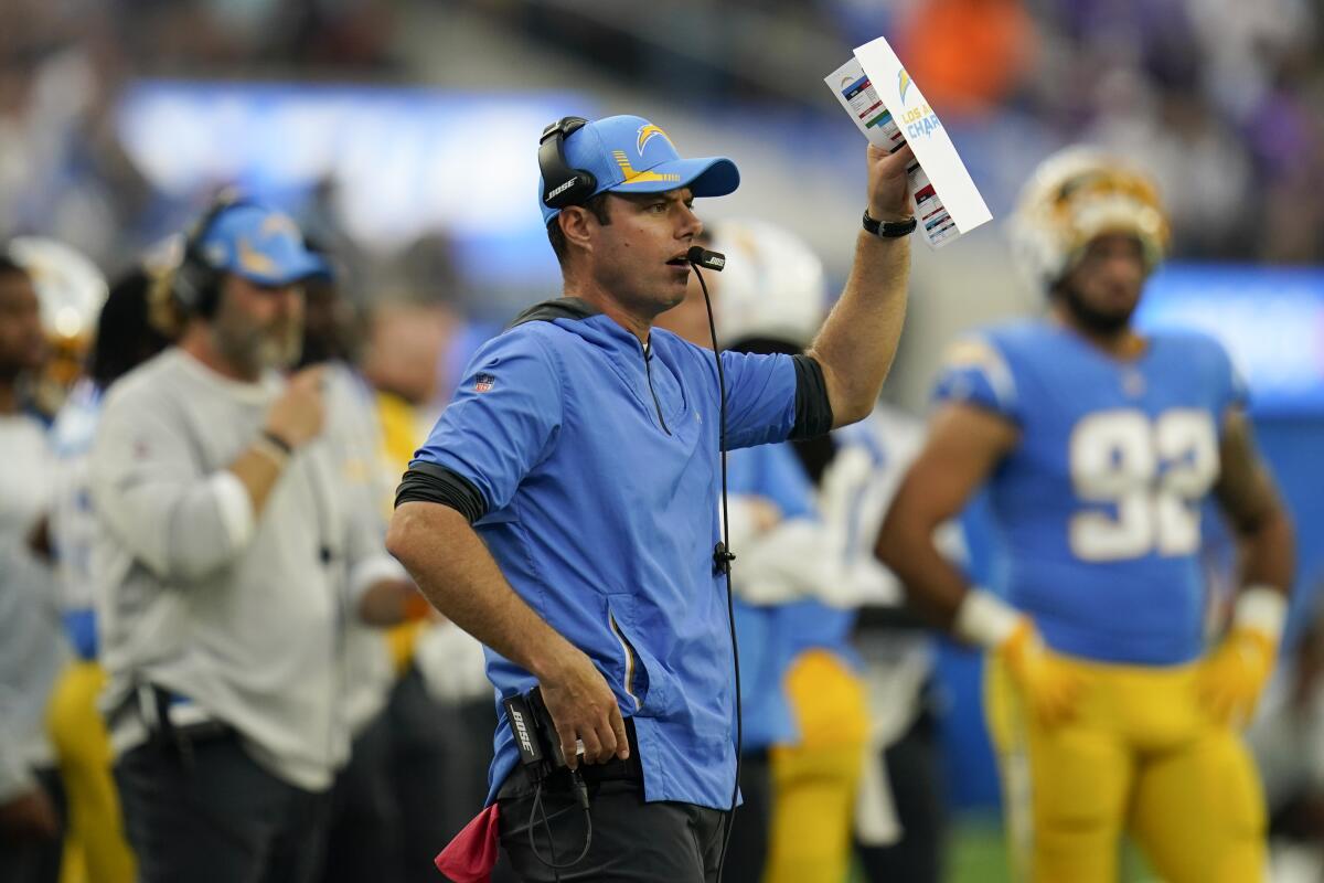 Chargers coach Brandon Staley stands on the sideline during a game against the Vikings.