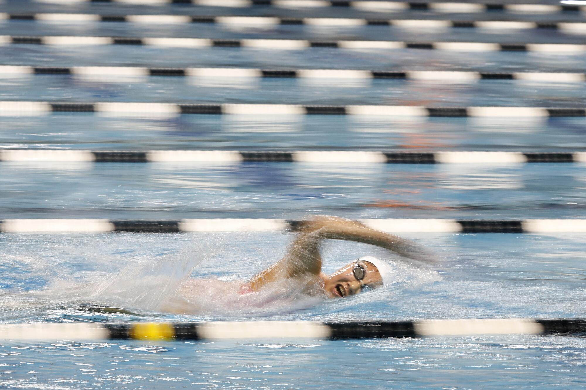 La Mirada Armada swimmer Kayla Han swims in a pool lane