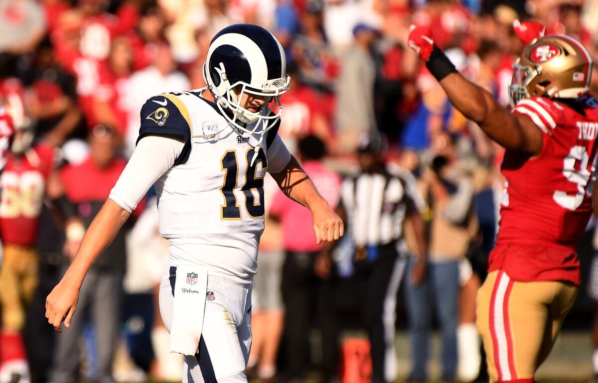 Ramas quarterback Jared Goff walks off the field against the 49ers.