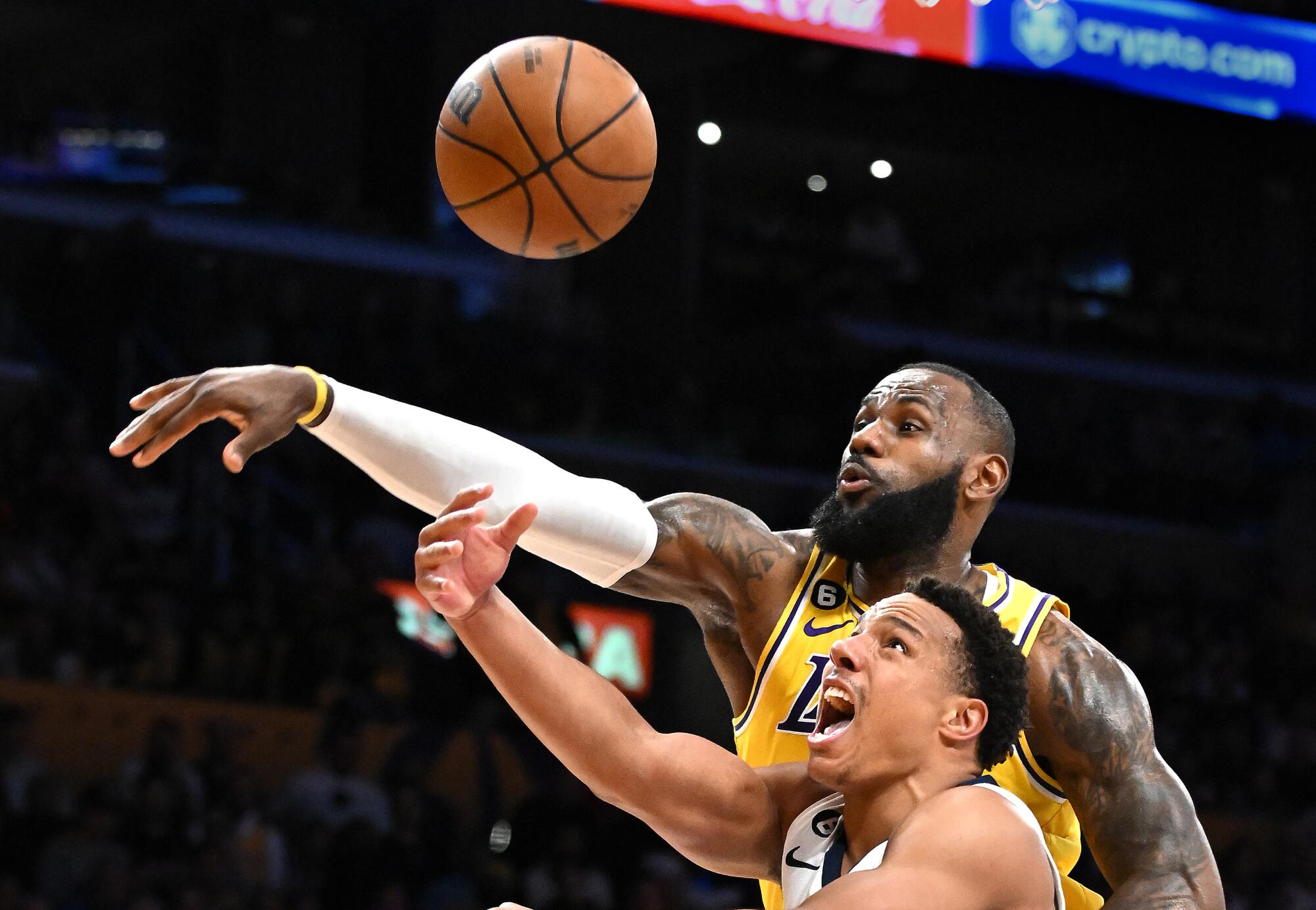 The Lakers' LeBron James blocks the shot of the Grizzlies' Desmond Bane in the second quarter.