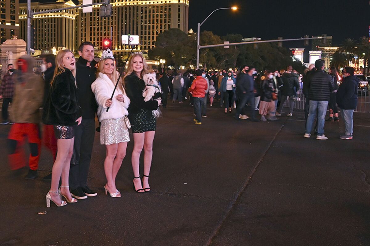 The Gallup family takes a photo along the Las Vegas Strip on New Year's Eve.