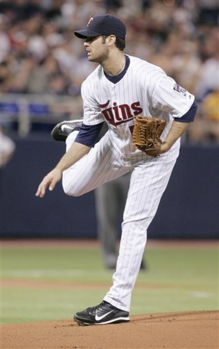 Minnesota Twins pitcher Nick Blackburn follows through against the New York Yankees in first inning of a baseball game Sunday, June 1, 2008, in Minneapolis. (AP Photo/Jim Mone)