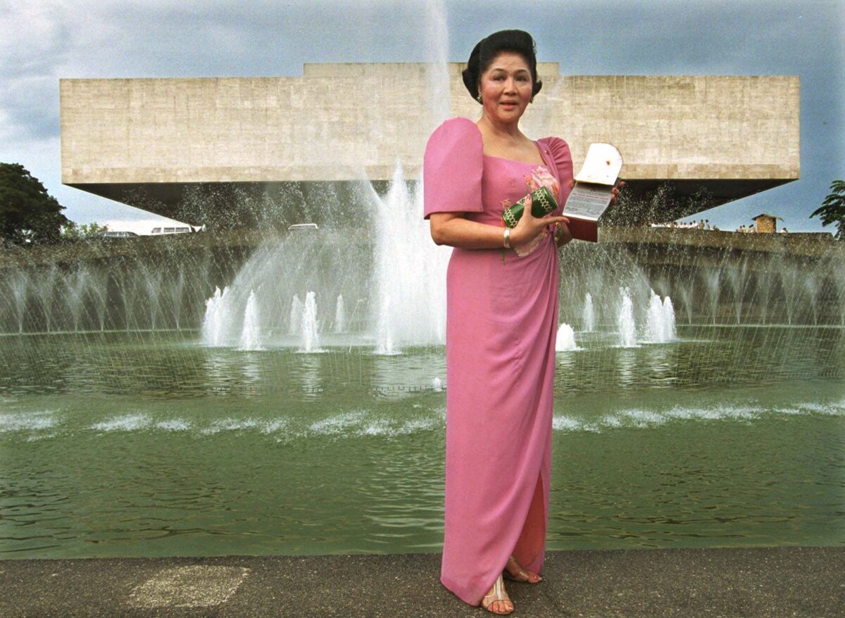 Former Philippine First Lady Imelda Marcos poses in front of the Cultural Center of the Philippines after a celebration in 1999. Marcos purchased numerous works of Western art that were seized by Philippine authorities in 2014.