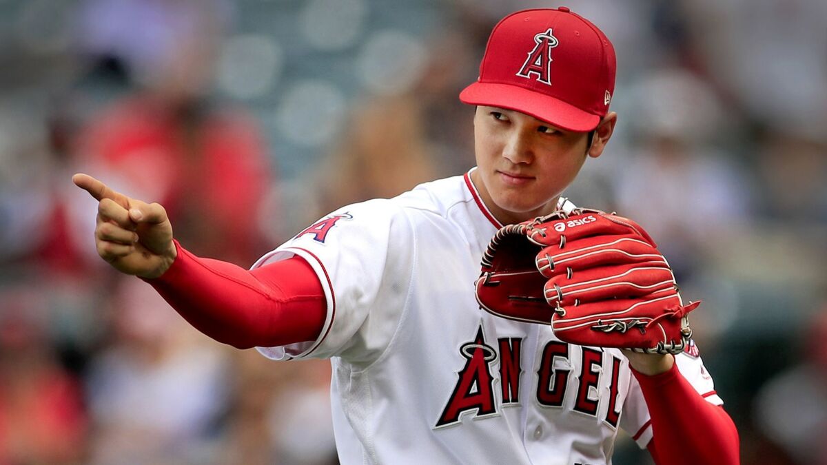 Shohei Ohtani gives up two runs and six hits in a career-high 7 2/3 innings, striking out nine, walking one and throwing a career-high 110 pitches, to improve to 4-1 with a 3.35 ERA, using his devastating split-fingered fastball and sharp slider to notch seven of his strikeouts.