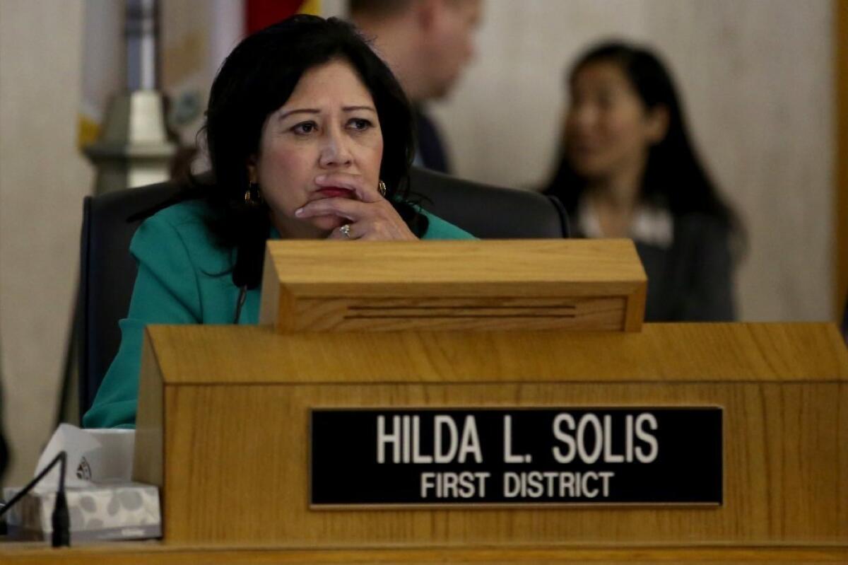 Los Angeles County Supervisor Hilda Solis listens during a Board of Supervisors meeting in July. In a vote last week, Solis temporarily blocked a proposal seeking state approval that would pave the way for a ballot initiative on funding to address homelessness.